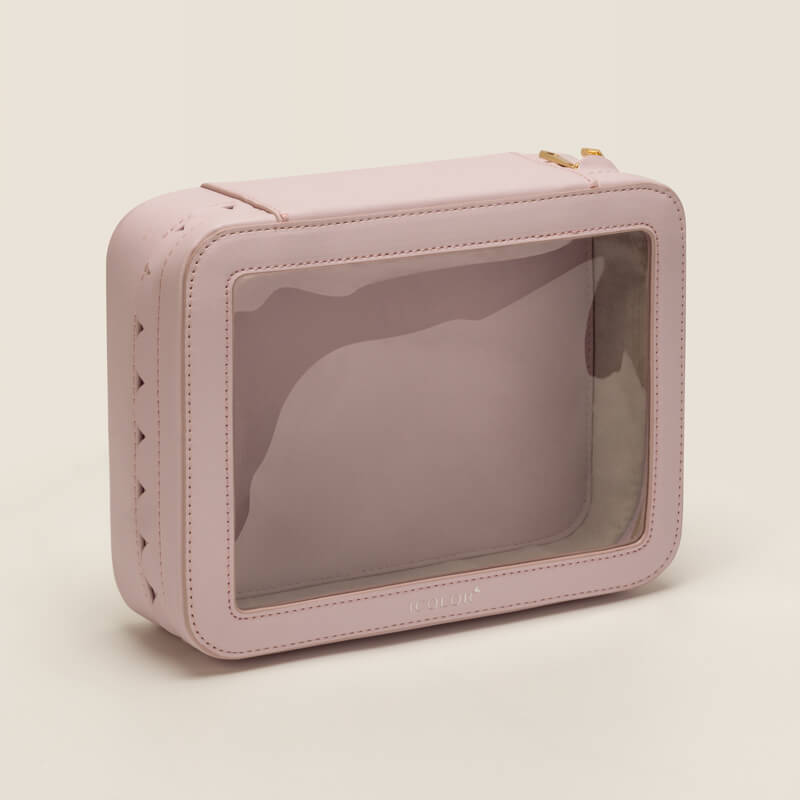 a close-up of a crystal clear TPU window on a stylish, sustainable toiletry bag