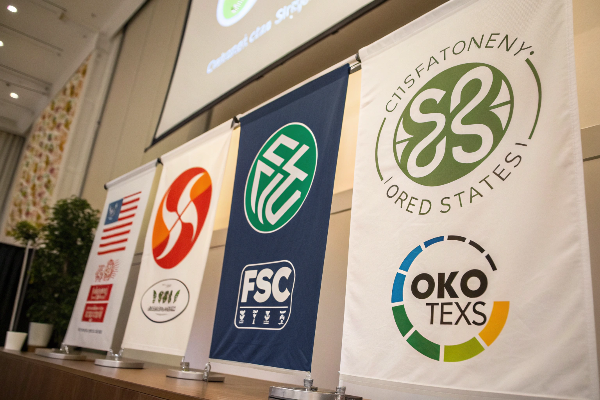 A collection of official certification logos like GRS, FSC, and OEKO-TEX