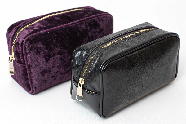 A luxurious velvet and a sleek PU leather makeup bag side-by-side