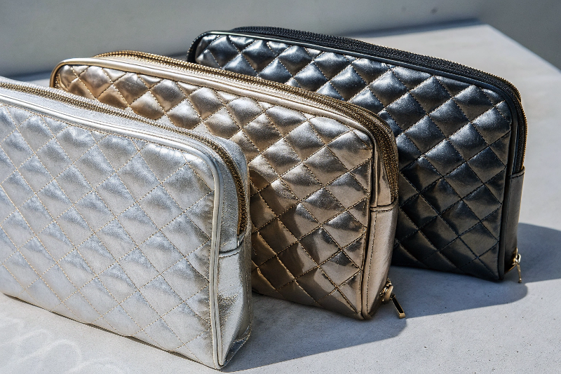 A stunning collection of cosmetic boxes showcasing different luxury finishes like gold foil, embossing, and spot UV.