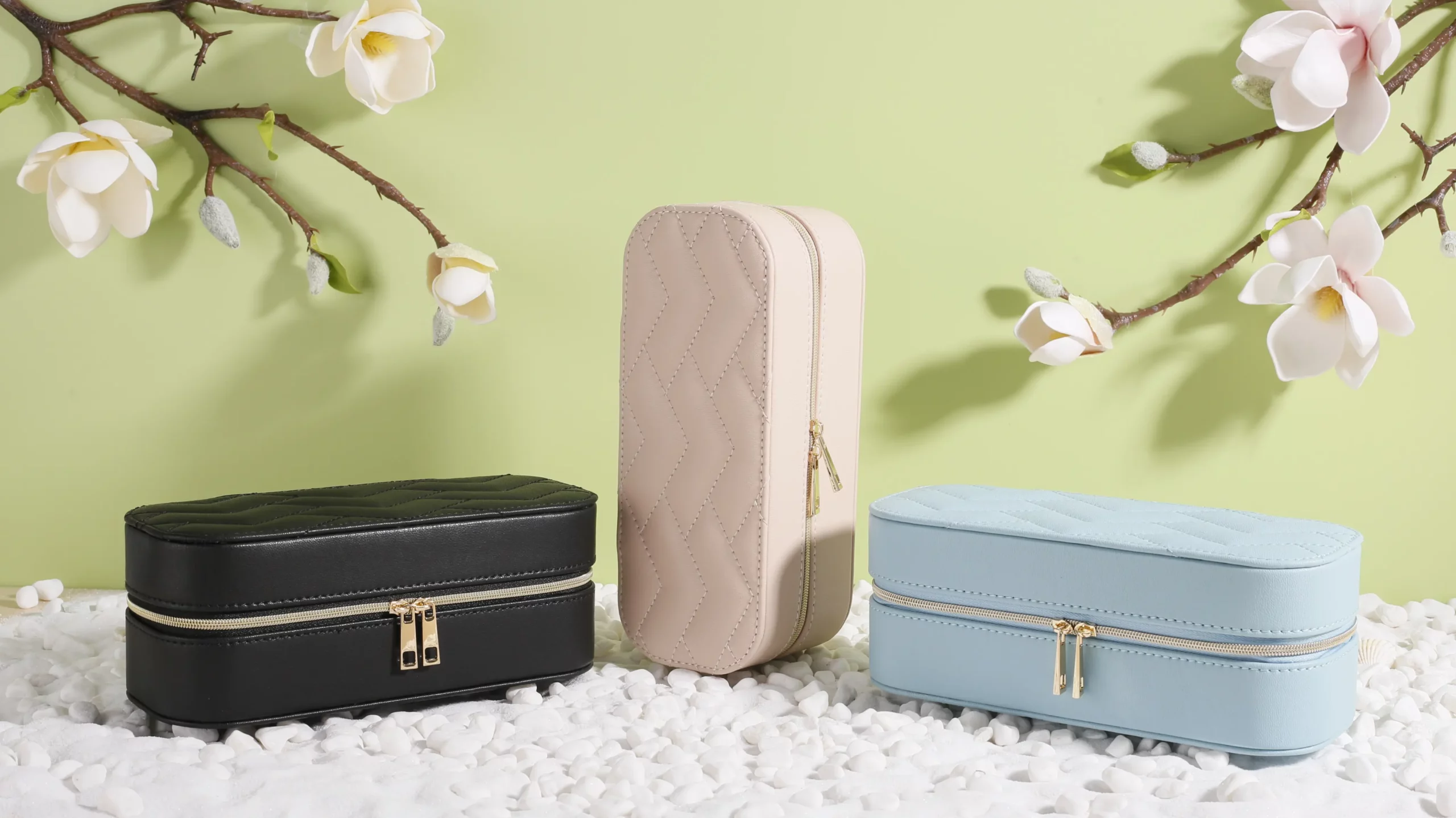 Apple leather jewelry box in black, beige, and light blue, made with eco-friendly vegan material for premium gift packaging.