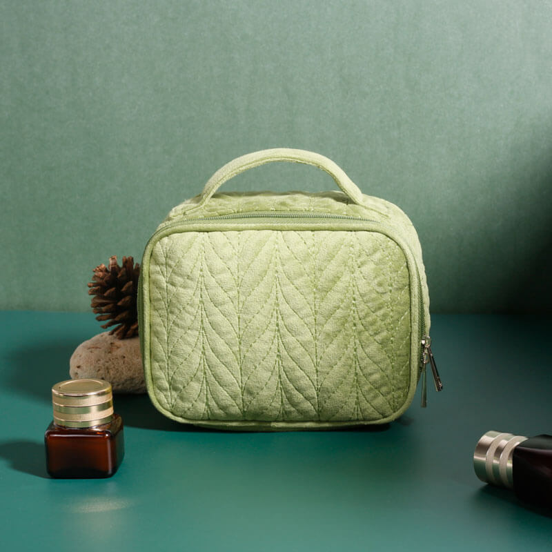 A detailed shot of a cosmetic bag made from rPET material showcasing a bright, intricate pattern