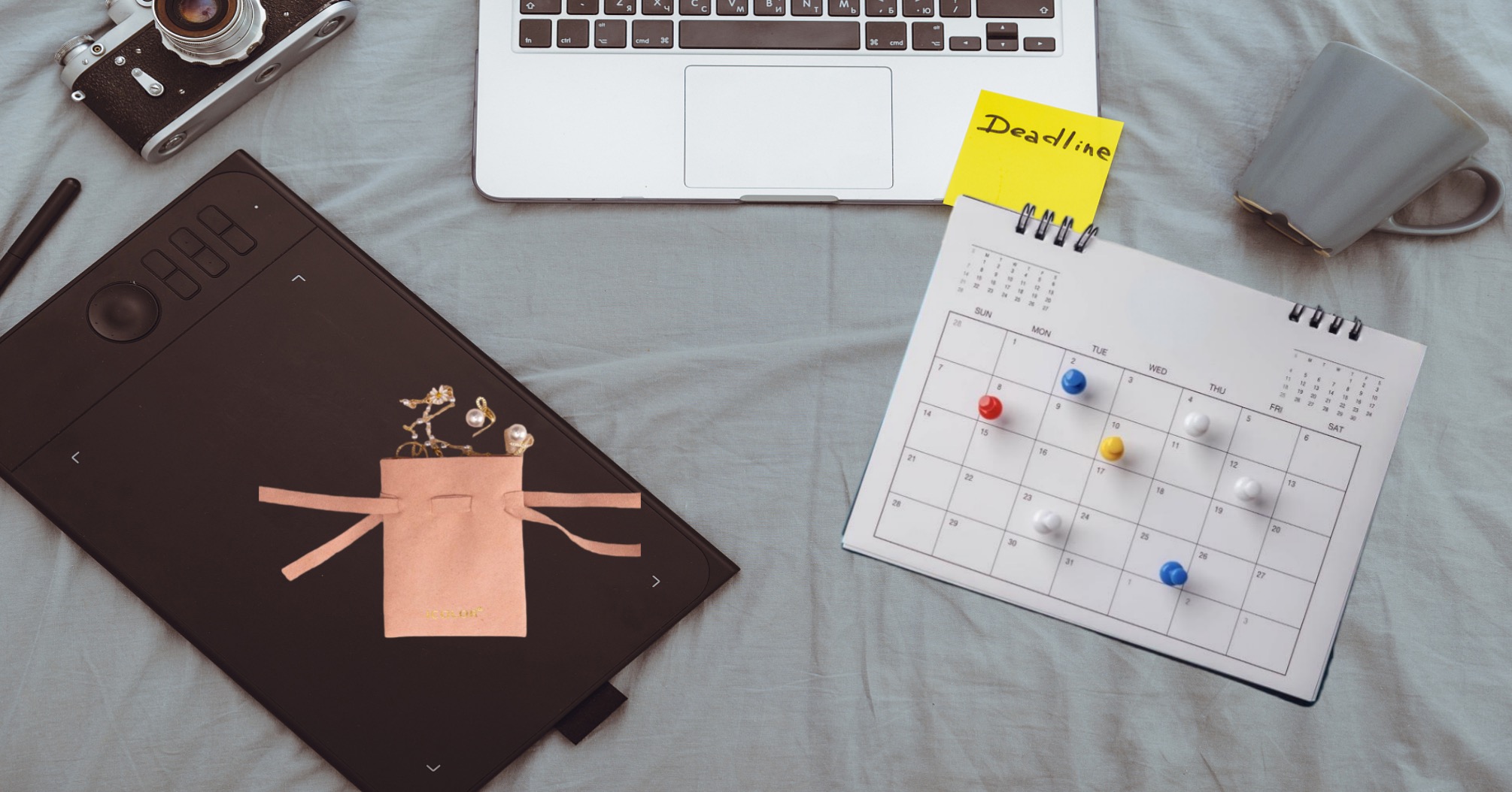 A person marking a calendar to plan packaging orders for the year