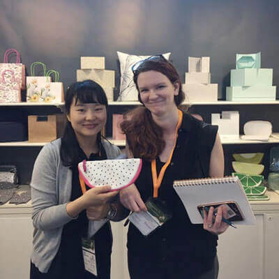 iColor team member collaborating with a client over material samples and design mock-ups