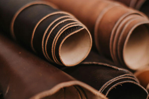 Rolls of standard PU leather in a factory setting