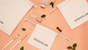 Natural cotton fabric essential oil drawstring bags with soft rope closure, ideal for storing small bottles and beauty accessories.