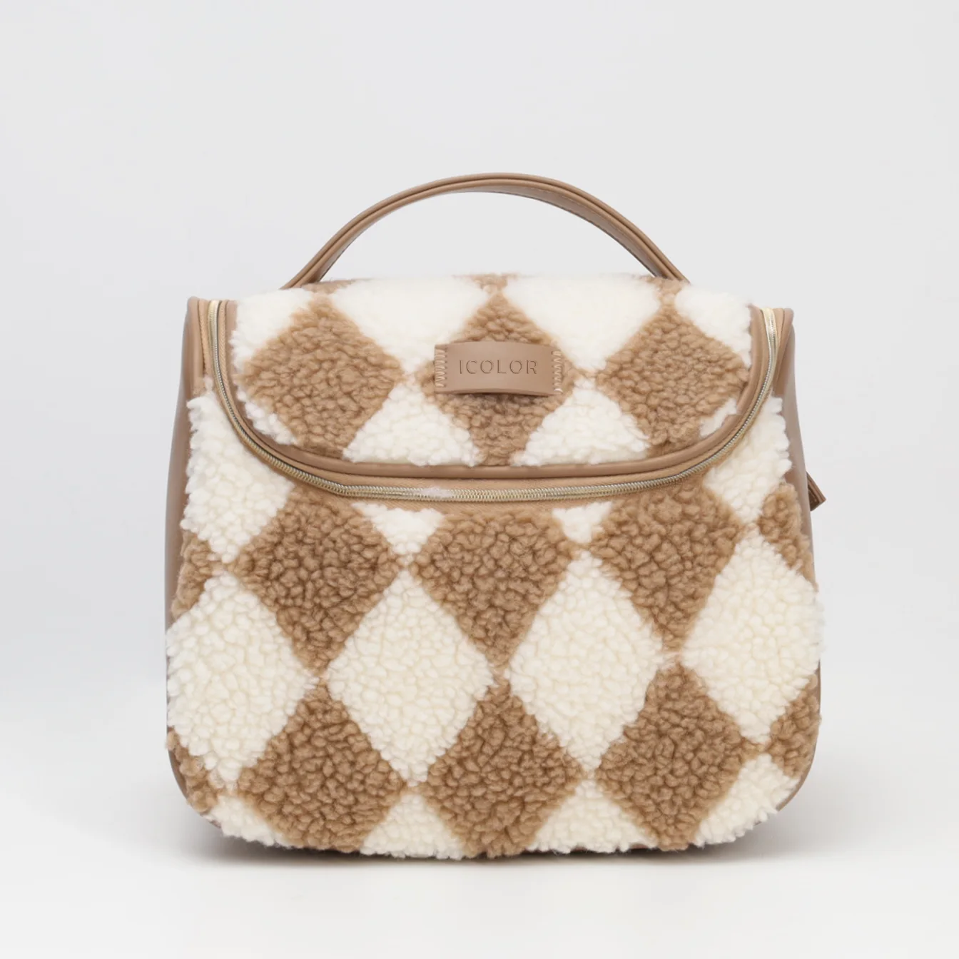Sherpa travel toiletry bag with handle in brown checkered pattern, ideal for cosmetic storage and winter travel kits.