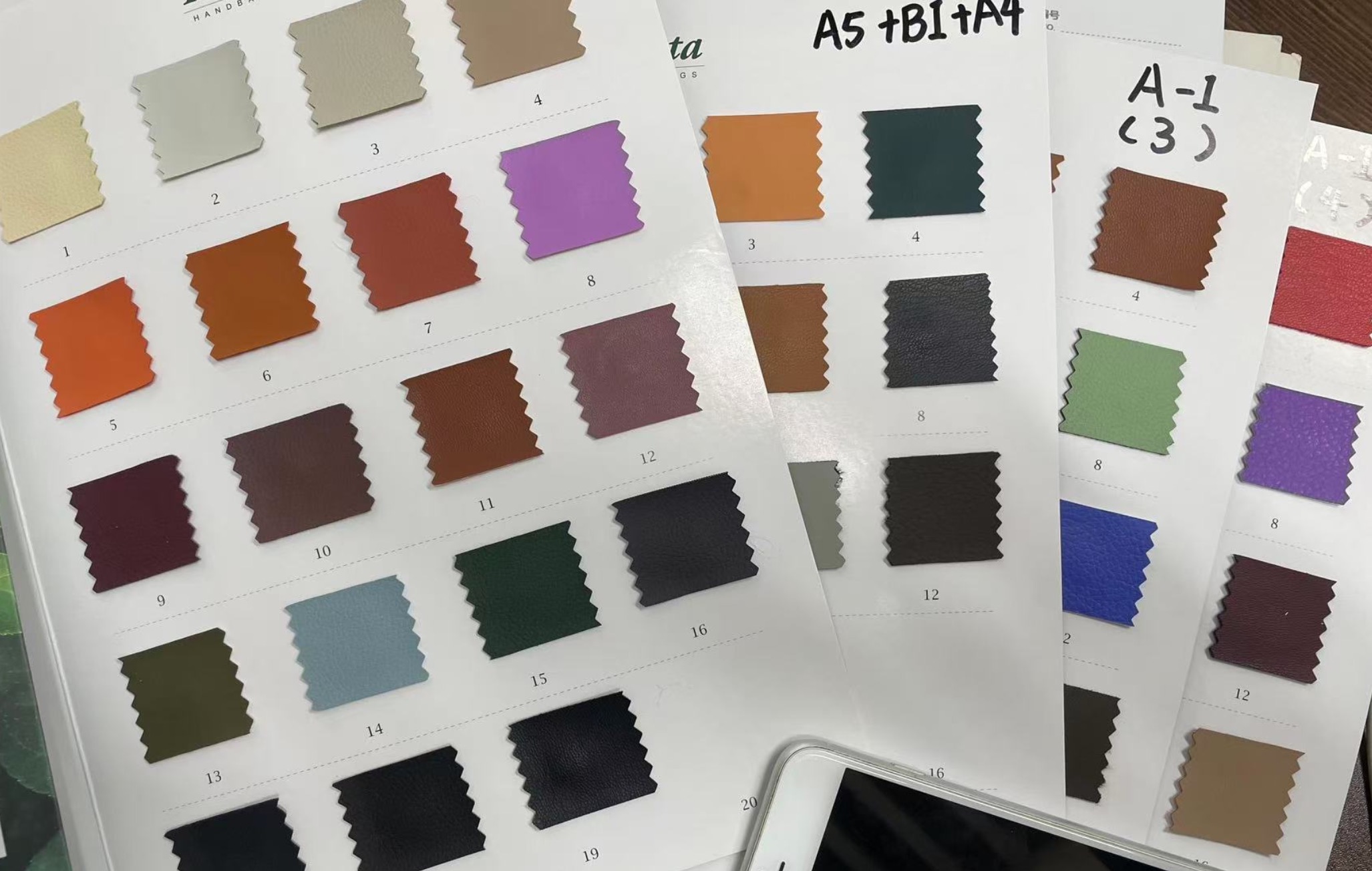 Collection of various vegan leather swatches including apple, corn, and bamboo textures