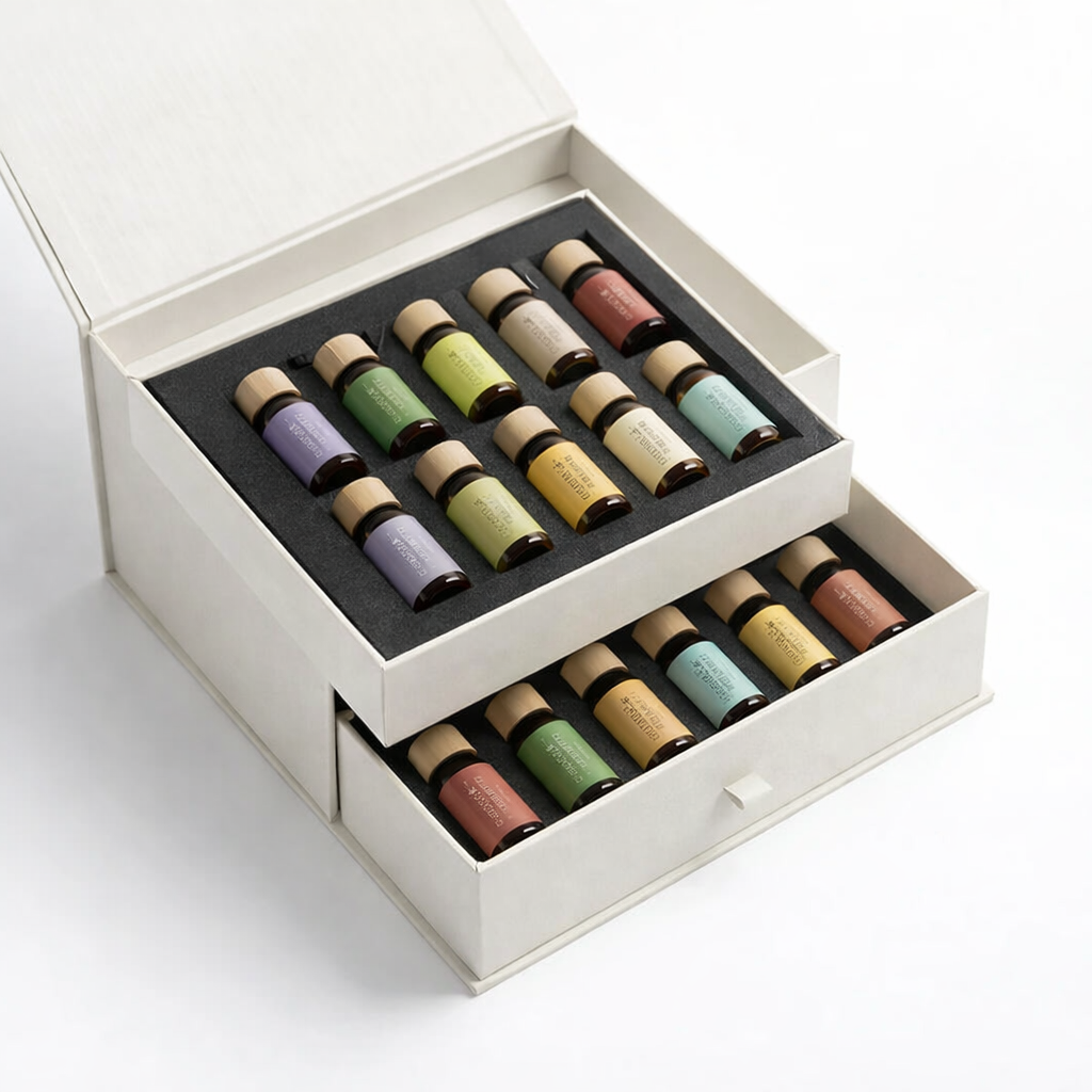 Top foam tray holding 12 essential oil bottles in a multi-layer rigid box packaging design