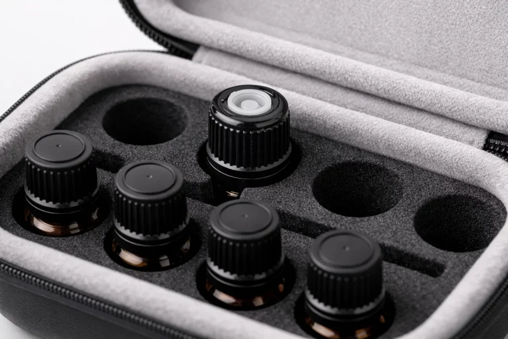 Soft velvet lining and foam insert holding essential oil bottles inside EVA hard shell case
