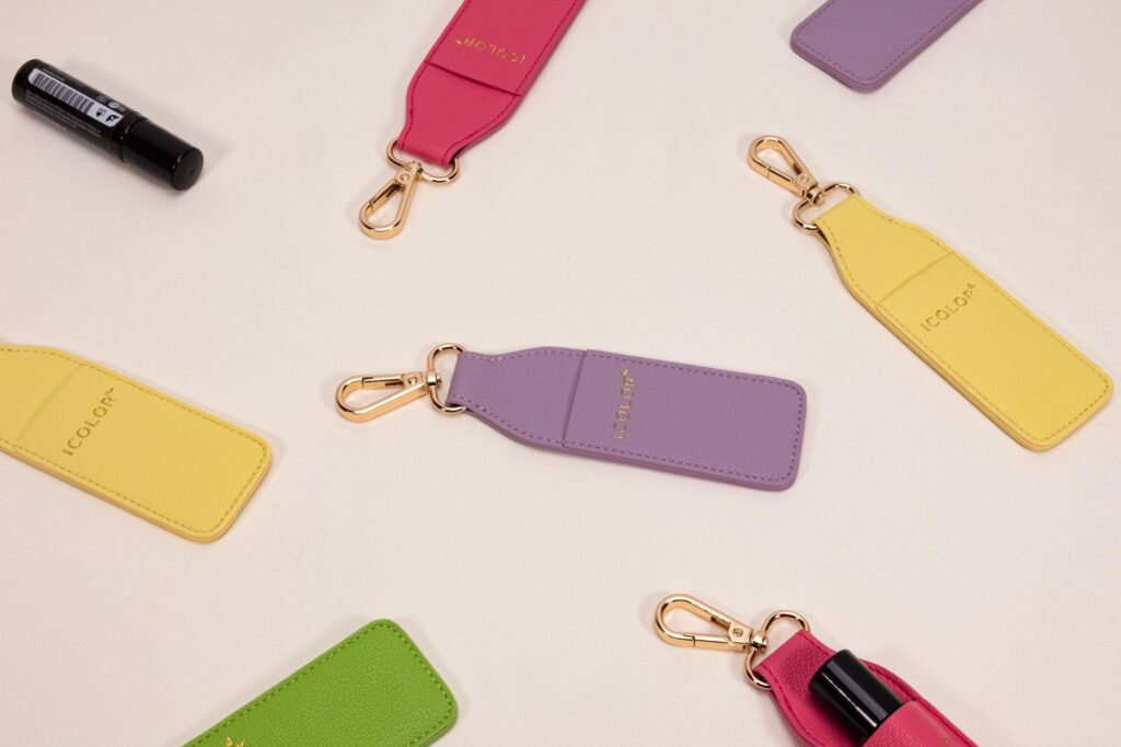 Mini keychain pouch holding one or two essential oil bottles for portable everyday carry