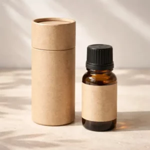 Natural kraft round paper tube beside an essential oil bottle